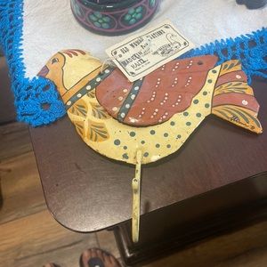 Cute metal chicken with hook.